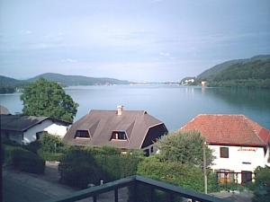 a house on the water with a view of a lake at Villa Margarethe in Reifnitz