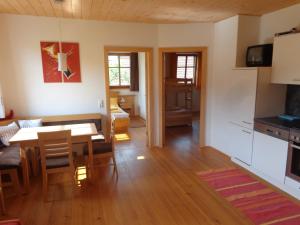 a living room with a table and a dining room at Biohof Stadler in Neustift im Mühlkreis