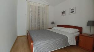 Posteľ alebo postele v izbe v ubytovaní Apartments Vlasici