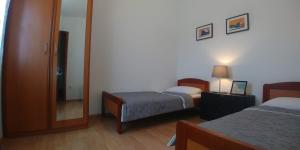 Posteľ alebo postele v izbe v ubytovaní Apartments Vlasici