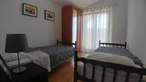 Posteľ alebo postele v izbe v ubytovaní Apartments Vlasici