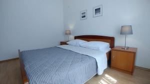 Posteľ alebo postele v izbe v ubytovaní Apartments Vlasici