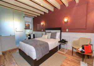 מיטה או מיטות בחדר ב-Casa Florencia Hotel Boutique