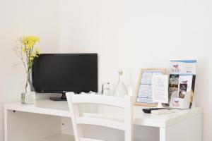 TV a/nebo společenská místnost v ubytování B&B Siracusa Holidays