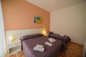 Postel nebo postele na pokoji v ubytování B&B Siracusa Holidays
