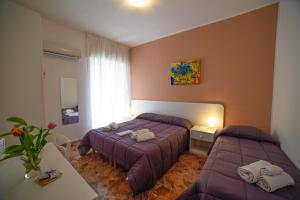Postel nebo postele na pokoji v ubytování B&B Siracusa Holidays