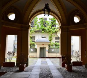 a building with an archway in front of a building at 18 Alfieri in Turin