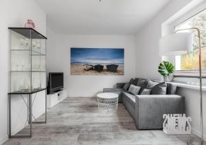 Televízia a/alebo spoločenská miestnosť v ubytovaní Apartament przy Bulwarze