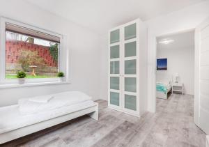 Posteľ alebo postele v izbe v ubytovaní Apartament przy Bulwarze