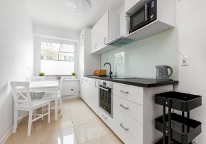 Kuchyňa alebo kuchynka v ubytovaní Apartament przy Bulwarze