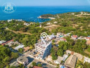 an aerial view of a resort near the ocean at Casa Puerto Bonito & Private Coworking in Puerto Escondido