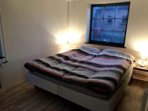 Postel nebo postele na pokoji v ubytování Genner Bygade 18 Feriehus + 6 fotografií