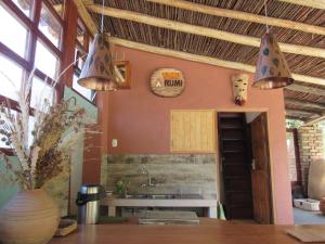 a kitchen with two lights hanging from the ceiling at YakuRumi Tipis & Glamping in Caraz