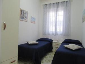 Postel nebo postele na pokoji v ubytování Villa Oltremare By Cala Salento