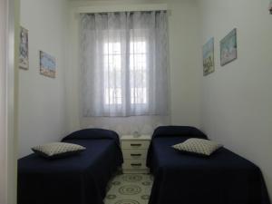 Postel nebo postele na pokoji v ubytování Villa Oltremare By Cala Salento
