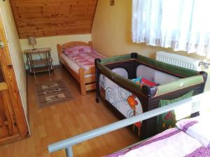 Postel nebo postele na pokoji v ubytování Dom na wzgórzu