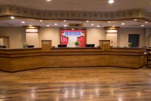 a large hall with a stage and a bar at Jackson Lake Lodge in Moran