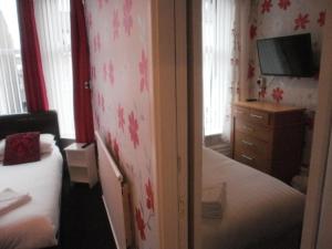 Postelja oz. postelje v sobi nastanitve The Withnell Hotel