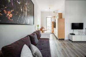 Televízia a/alebo spoločenská miestnosť v ubytovaní Kierunek Sopot Apartament GRACJA Monte Cassino 36