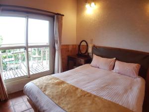 Voodi või voodid majutusasutuse Shan Shui-Yuan Vege Guest House toas