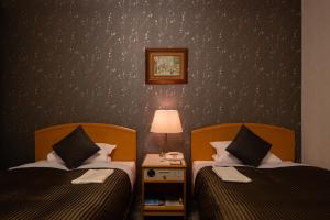 Postel nebo postele na pokoji v ubytování Hotel Okura Niigata