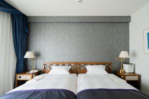 Postel nebo postele na pokoji v ubytování Hotel Okura Niigata