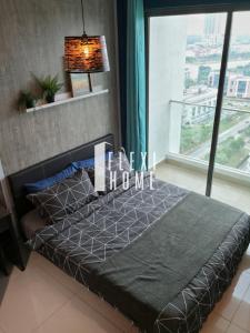a bedroom with a bed and a large window at Cybersquare 19 Cozy Studio Home Cyberjaya, Flexihome-MY in Cyberjaya