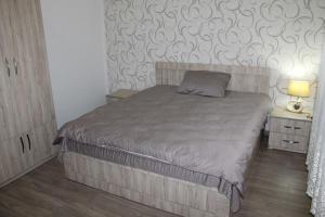 Postel nebo postele na pokoji v ubytování Guest House Lviv Грузия