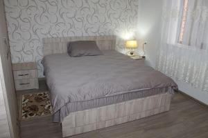 Postel nebo postele na pokoji v ubytování Guest House Lviv Грузия