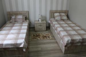 Postel nebo postele na pokoji v ubytování Guest House Lviv Грузия