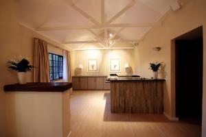a large living room with a coffered ceiling at Gardenview Guest House in Port Elizabeth