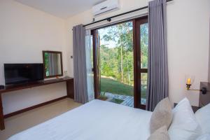 Ένα ή περισσότερα κρεβάτια σε δωμάτιο στο The Fortress Balumgala