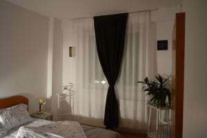M@D Apartment tesisinde bir odada yatak veya yataklar
