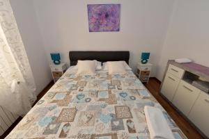Postel nebo postele na pokoji v ubytování Apartment Simoni ZD