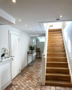 a staircase in a home with wooden steps at 5:ans Bed & Breakfast in Gothenburg