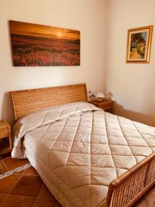 Postel nebo postele na pokoji v ubytování Appartamento in Villa