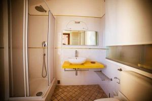 
a bathroom with a shower, sink, and toilet at Camere Nicolina in Vernazza
