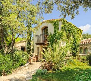 a house with a balcony on the side of it at Lodge de Charme A Cheda in Bonifacio