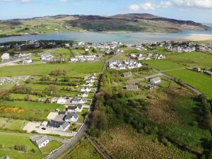 an aerial view of a village next to a body of water at Kings Accommodation in Donegal
