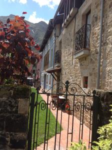 a wrought iron gate in front of a building at Casa de la Tila in Arenas de Cabrales