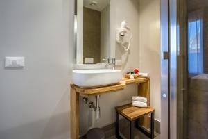 a bathroom with a white sink and a mirror at Palazzo dei Conti Residenza d'Epoca in Florence +37 photos
