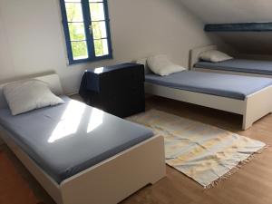 מיטה או מיטות בחדר ב-Gites-Cyclistes-Léon
