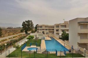 Vista de la piscina de Apartamento Tania - El Toyo - Cabo de Gata o d'una piscina que hi ha a prop