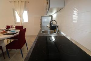 Kuchyňa alebo kuchynka v ubytovaní Apartman La maison