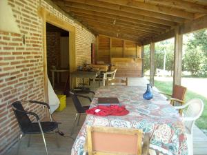 a patio with a table with a laptop on it at Gites-Cyclistes-Léon in Léon
