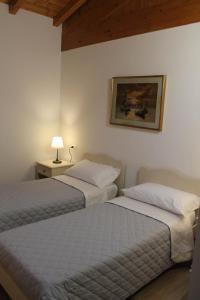 Posteľ alebo postele v izbe v ubytovaní Corte Nuova B&B