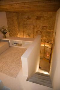 
a room with a toilet and a bathtub in it at S'Hotelet de Santanyi in Santanyi
