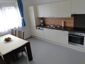 Köök või kööginurk majutusasutuses Apartment Ferienwohnung Kogler