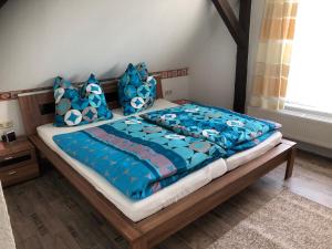 Llit o llits en una habitació de Ferienwohnung am Rande der Dübener Heide