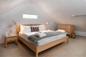 a bedroom with a bed in a attic at Mo & Rose at Soekershof in Robertson